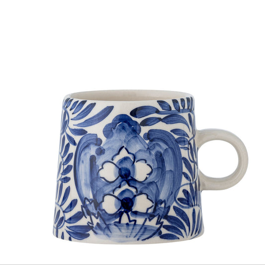 The blue and white stoneware hand painted mug is inspired by the aesthetic of the mediteranian