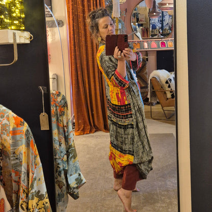 A reversible silk kimono made with vintage up-cycled silk sari fabric. Each side  is completely different and each kimono is completely unique