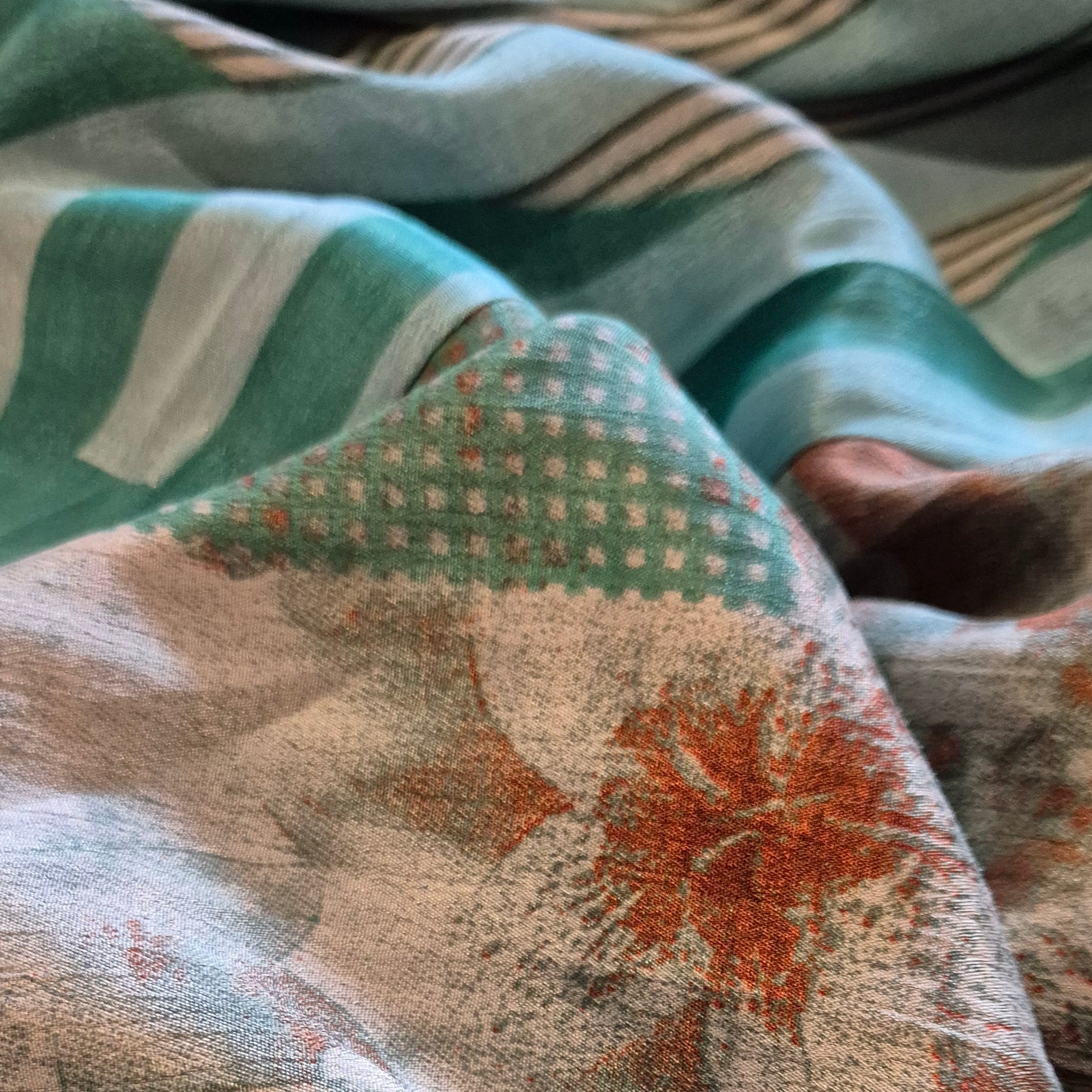 A reversible silk kimono made with vintage up-cycled silk sari fabric. Each side  is completely different and each kimono is completely unique
