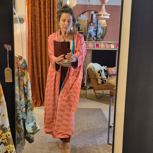A reversible silk kimono made with vintage up-cycled silk sari fabric. Each side  is completely different and each kimono is completely unique