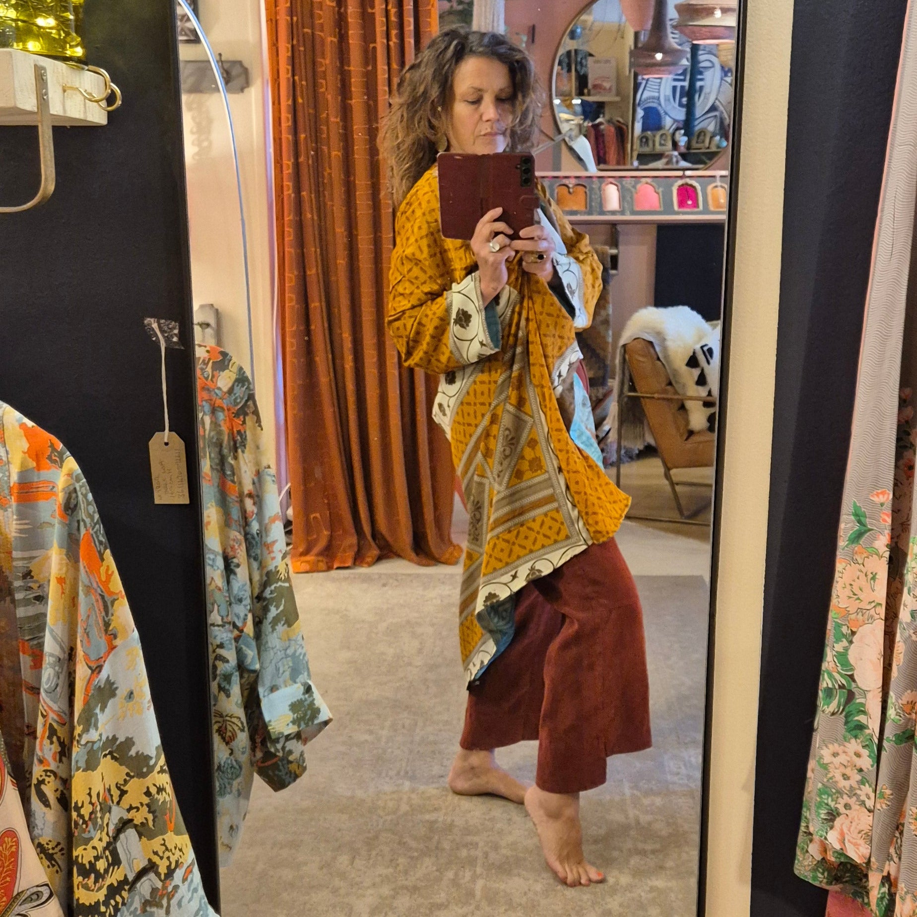 A reversible silk kimono made with vintage up-cycled silk sari fabric. Each side  is completely different and each kimono is completely unique