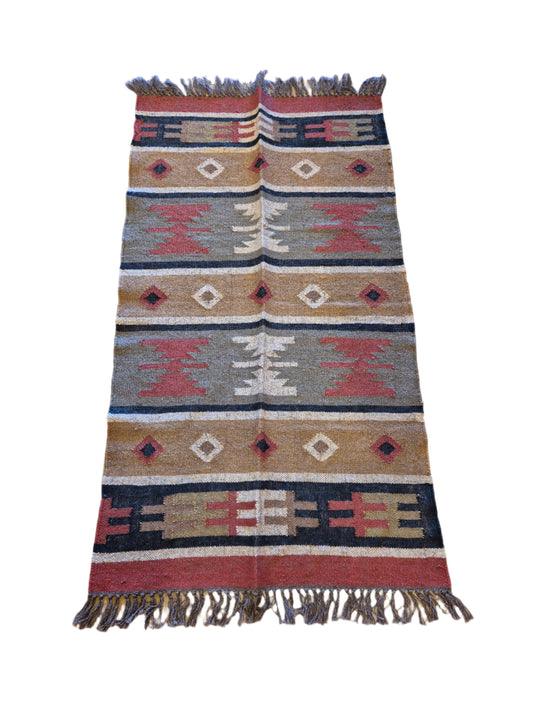 Add a touch of classic elegance to your space with this Kilim Rug (krs5). Handcrafted with wool and jute for a rich and textured look, this 5x3ft rug boasts a beautiful earthy color palette that will bring warmth to any room.

5x3ft