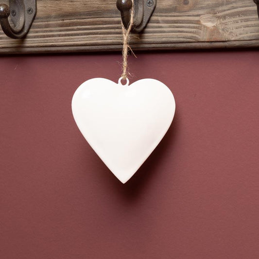 white enamel heart hanging on jute string