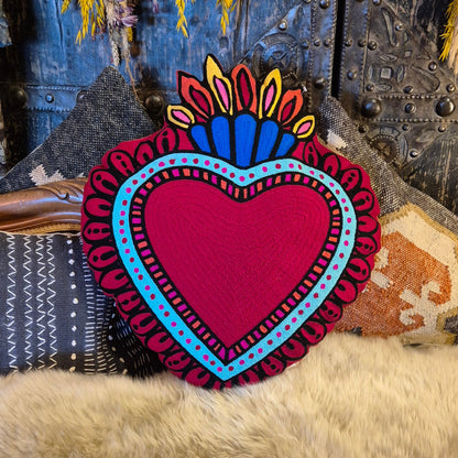 Back in stock. A statement cushion. The ever popular Milagro Heart Cushion in pink, is also available in red. Milagro means small miracle in Spanish and the Milagro Heart represents love healing and gratitude.
