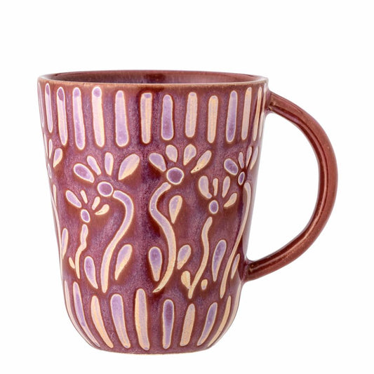 Ceramic mug with decorative pattern on a white background