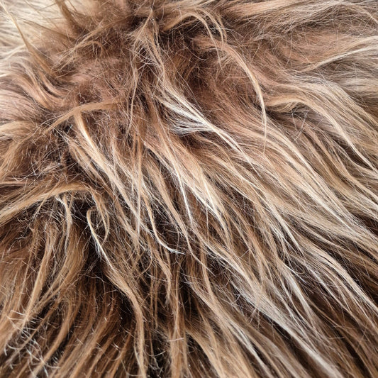 long haired Icelandic sheepskin rug. very luxurious, soft and it comes in a rusty brown with slightly lighter tips. A very bohemian addition to your home