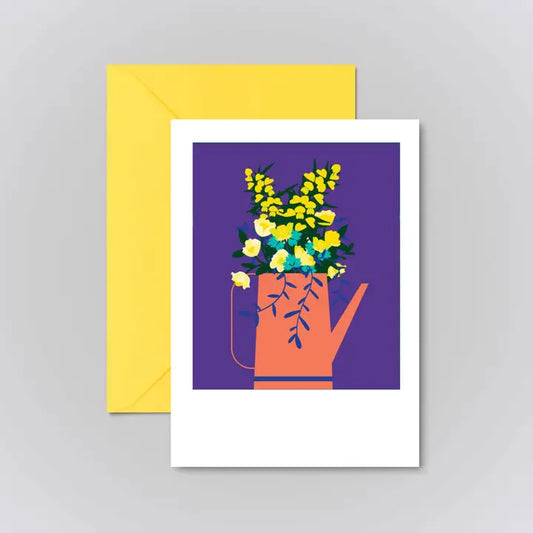 Beautifully illustrated card with yellow flowers in an orange jug with a purple background and framed in white.