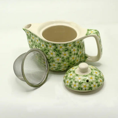 Small teapot with green mosaic pattern. Comes with tea leaf strainer. Can be complimented with cups from the same collection.

Ceramic