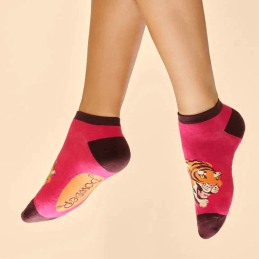 The thrill of the tiger is a trainer sock made from the softest bamboo and it feels fabulous under foot. a tiger on a deep pink background