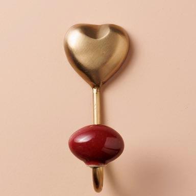 brass heart with red hook