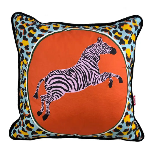 leaping pale pink and black zebra against an orange circle and with animal print. backed in luxurious velvet and is piped in velvet too This cushion is 45 x 45cm